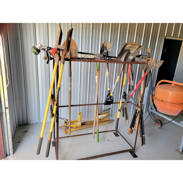 Fabricated iron tool rack with garden tools.