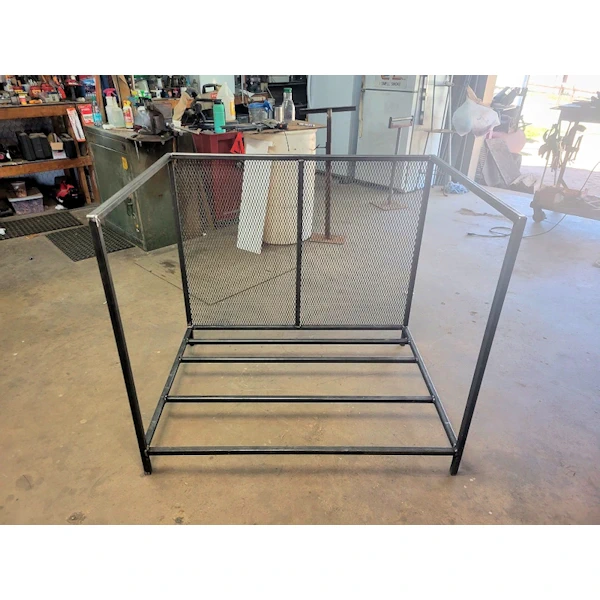 Fabricated iron tool rack with garden tools.